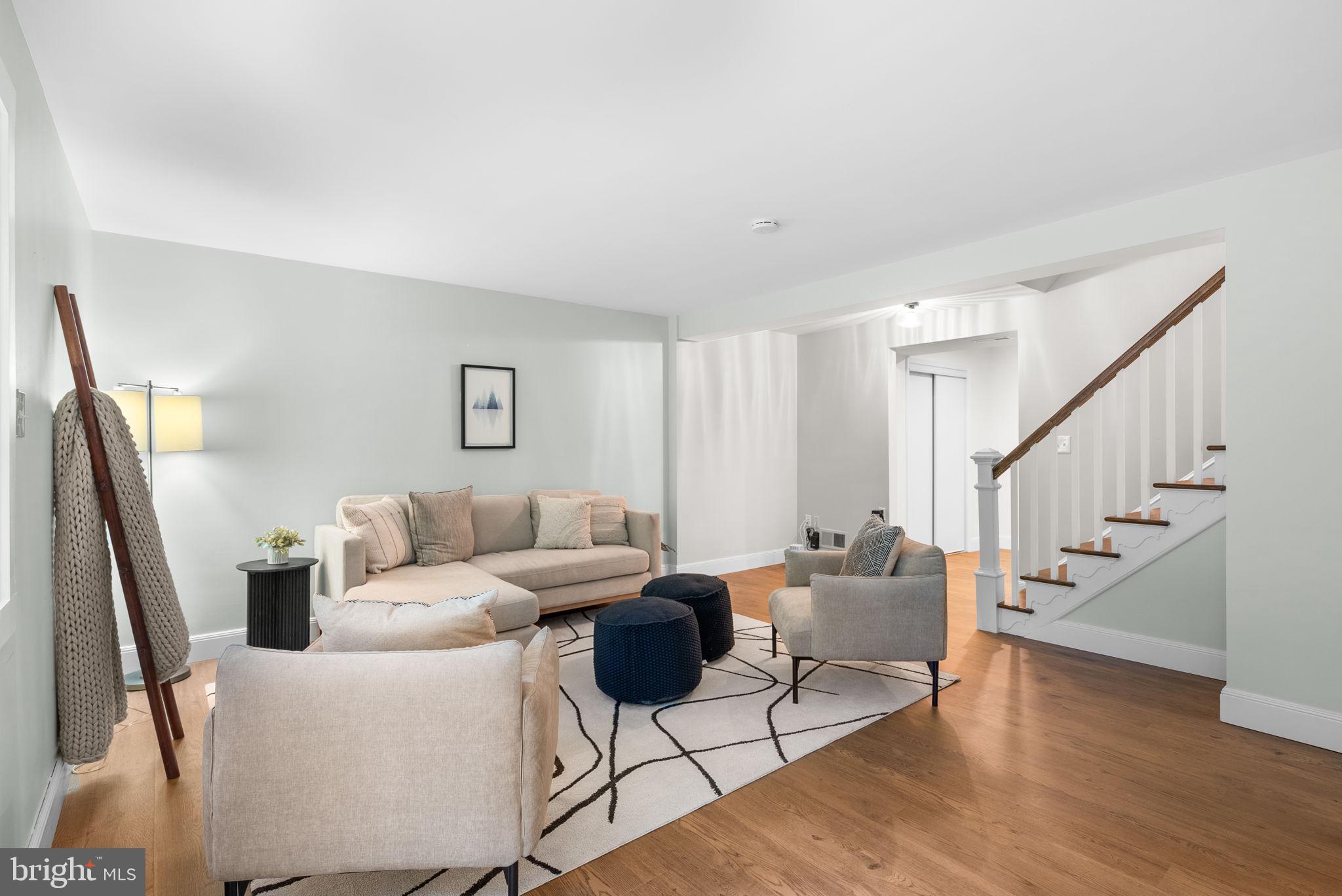 9907 Big Rock Road Silver Spring, MD 20901 - Photo 29 of 45 a living room with furniture and a wooden floor