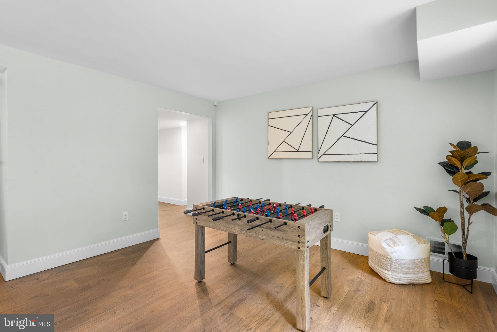 9907 Big Rock Road Silver Spring, MD 20901 - Photo 30 of 45 a dining room with furniture and wooden floor