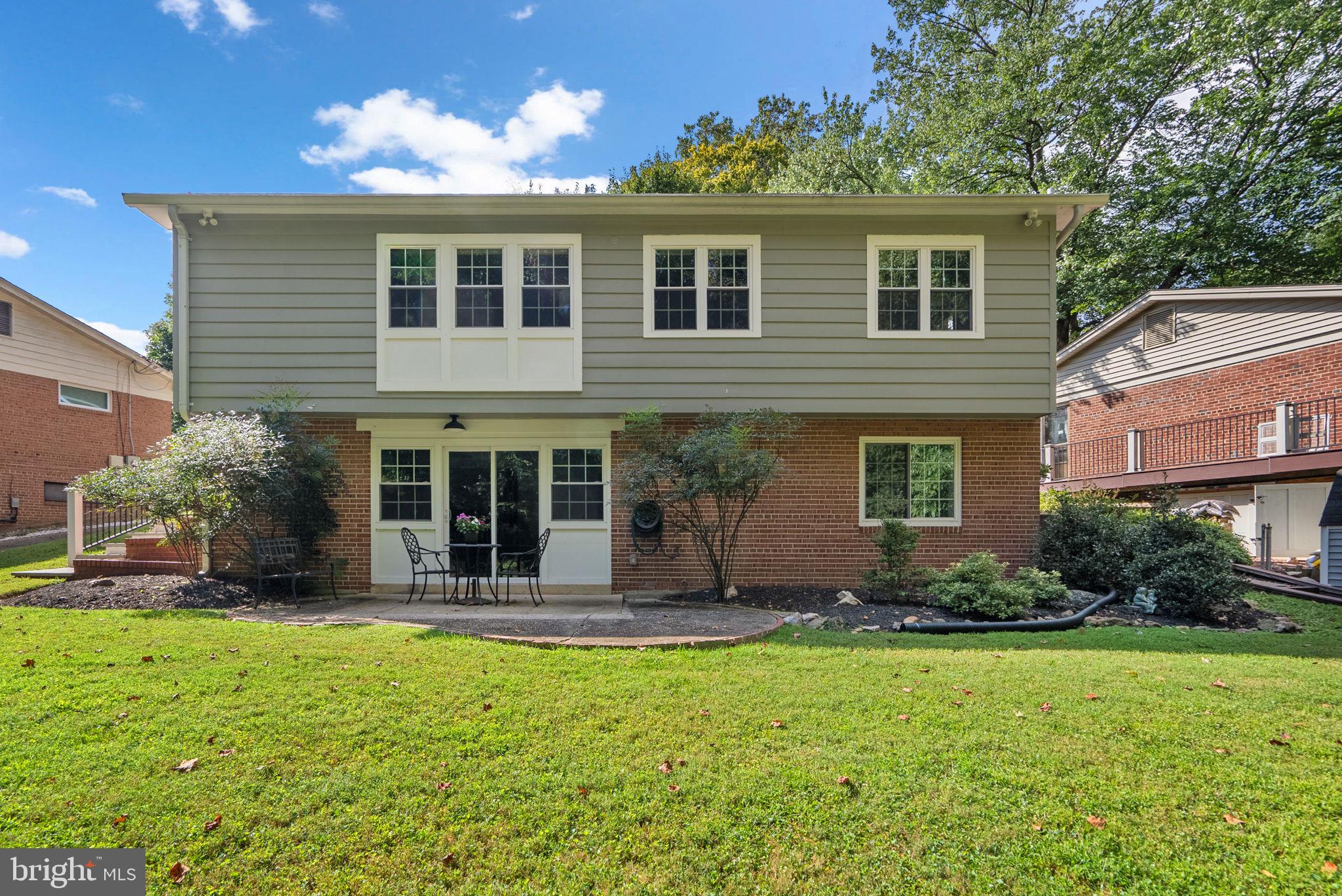 9907 Big Rock Road Silver Spring, MD 20901 - Photo 3 of 45 a front view of a house with a yard