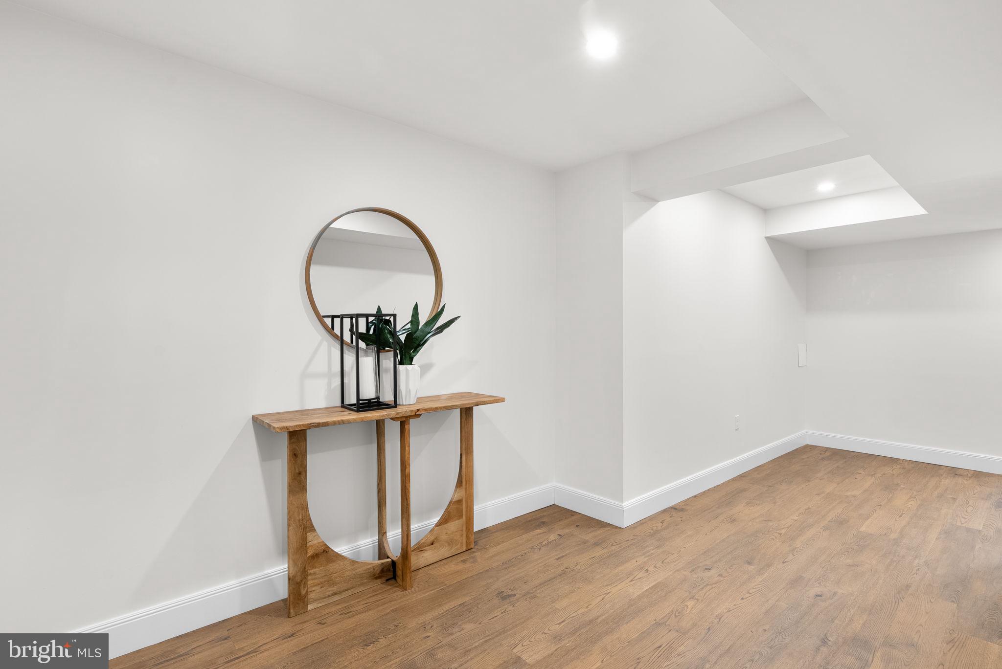 9907 Big Rock Road Silver Spring, MD 20901 - Photo 32 of 45 a view of a livingroom with wooden floor and a potted plant