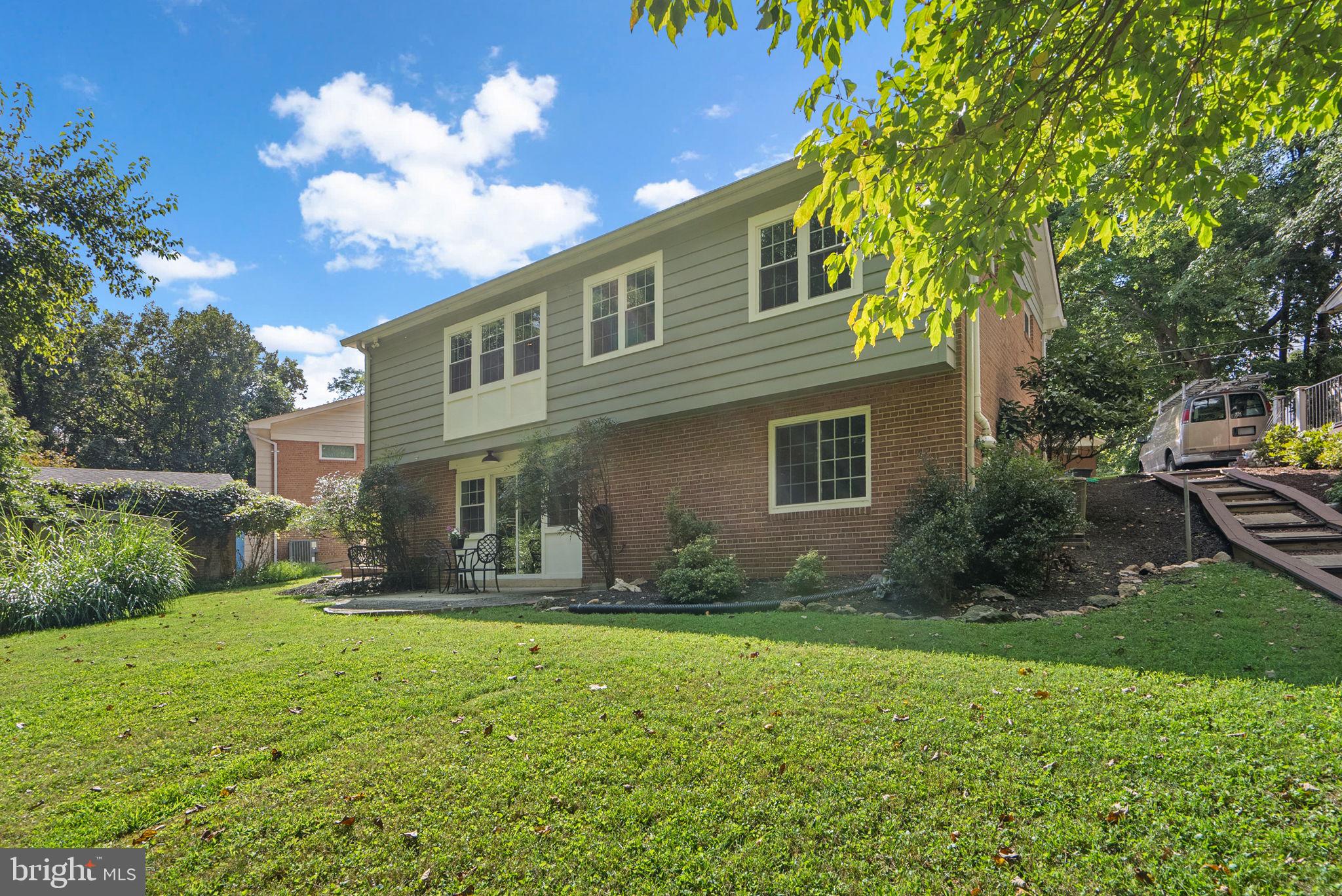9907 Big Rock Road Silver Spring, MD 20901 - Photo 42 of 45 a front view of house with yard and green space