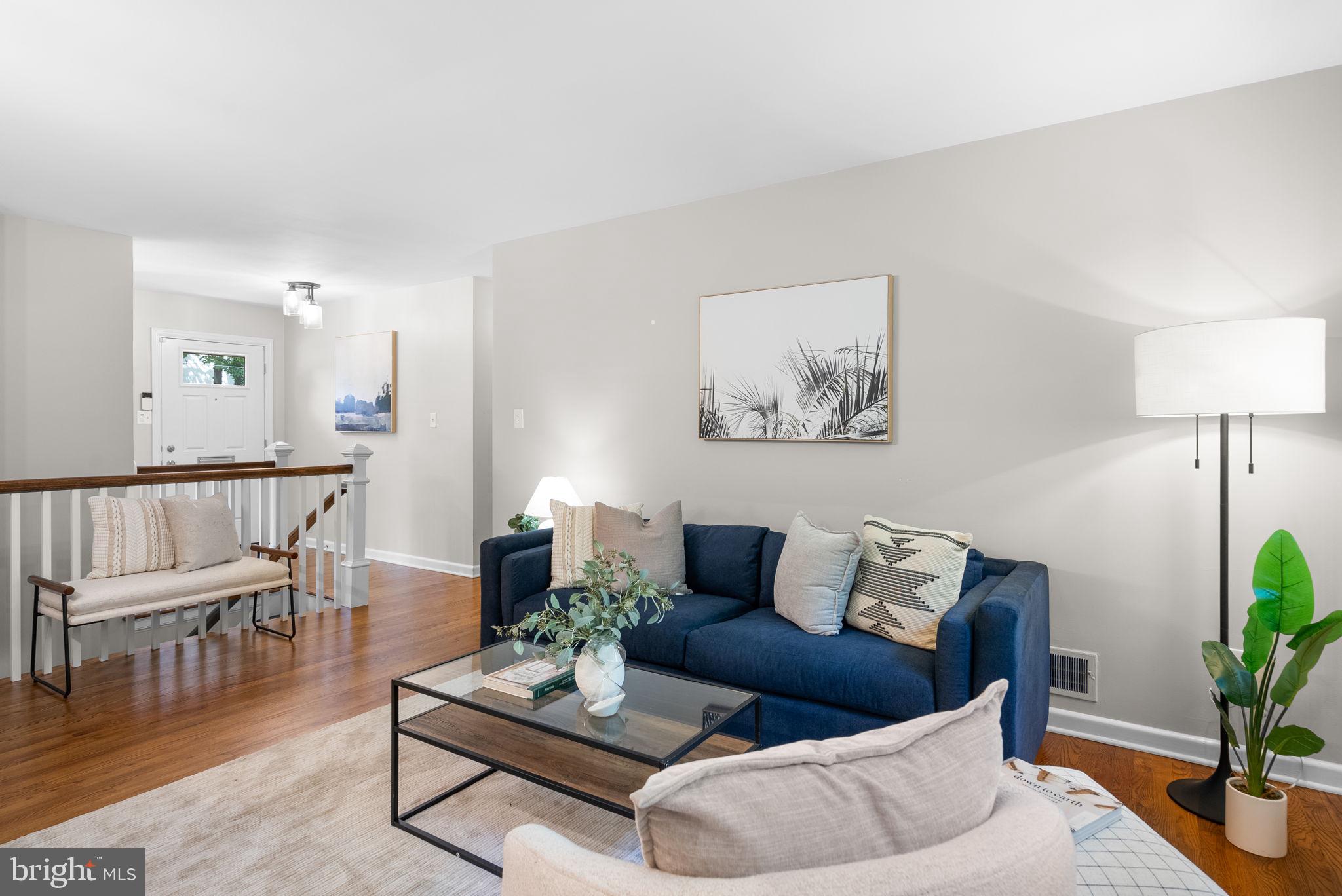 9907 Big Rock Road Silver Spring, MD 20901 - Photo 6 of 45 a living room with furniture and wooden floor
