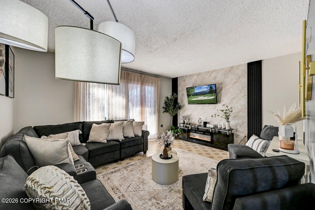 844 South Front Street Allentown, PA 18103 - Photo 12 of 45 a living room with furniture and a flat screen tv