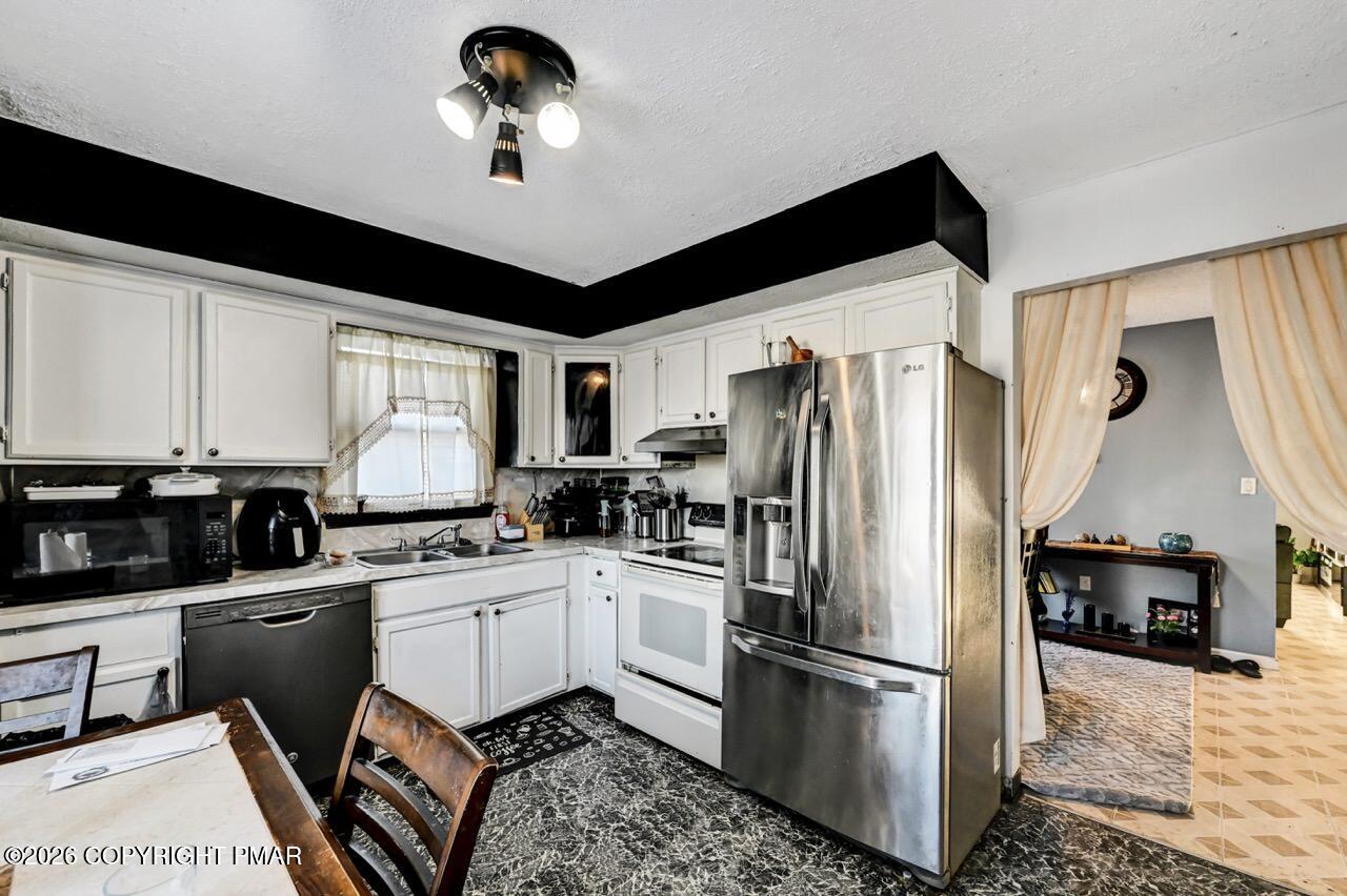 844 South Front Street Allentown, PA 18103 - Photo 21 of 45 a kitchen with stainless steel appliances granite countertop a refrigerator a stove a sink and a stove