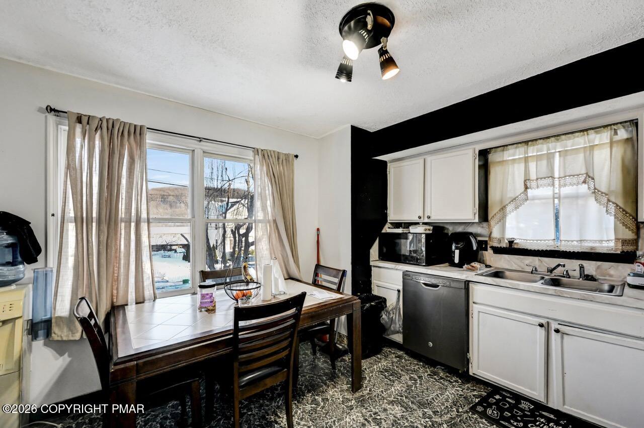 844 South Front Street Allentown, PA 18103 - Photo 23 of 45 a room with furniture a flat screen tv and a view of kitchen