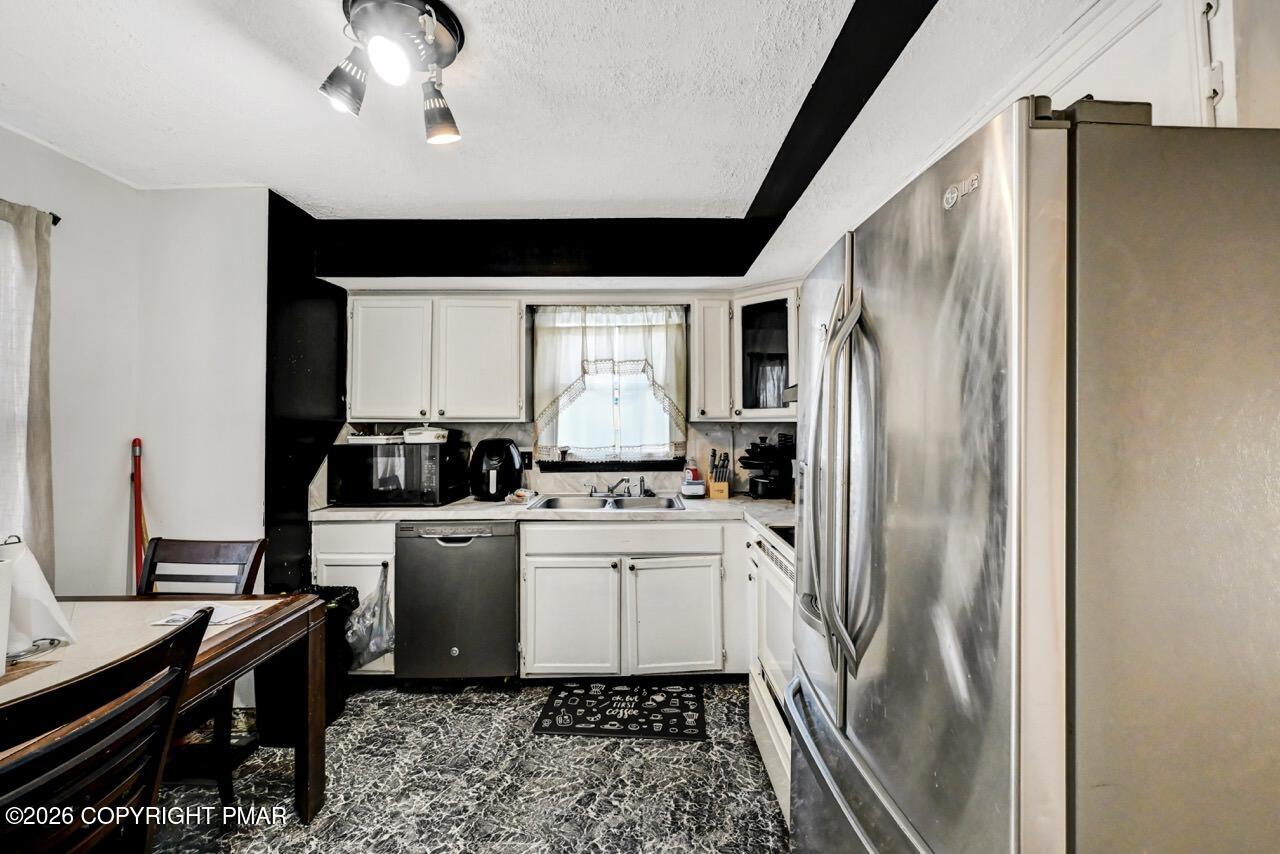 844 South Front Street Allentown, PA 18103 - Photo 26 of 45 a kitchen with a refrigerator and a sink