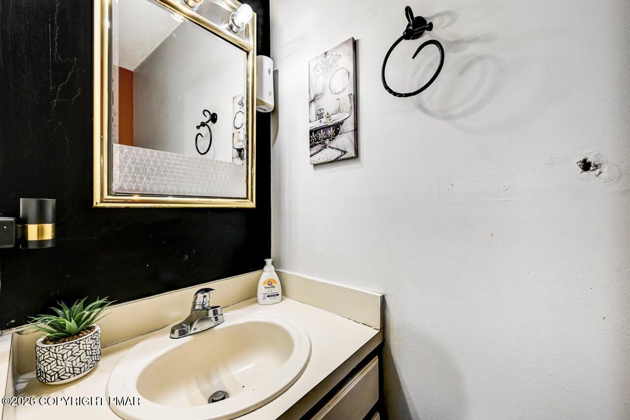 844 South Front Street Allentown, PA 18103 - Photo 27 of 45 a bathroom with a sink and a mirror