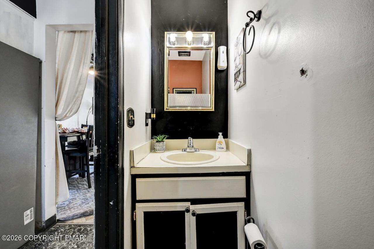 844 South Front Street Allentown, PA 18103 - Photo 28 of 45 a bathroom with a sink and a mirror