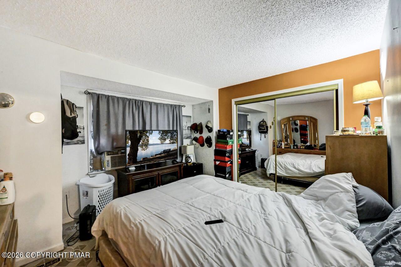 844 South Front Street Allentown, PA 18103 - Photo 30 of 45 a bedroom with a bed and a large mirror