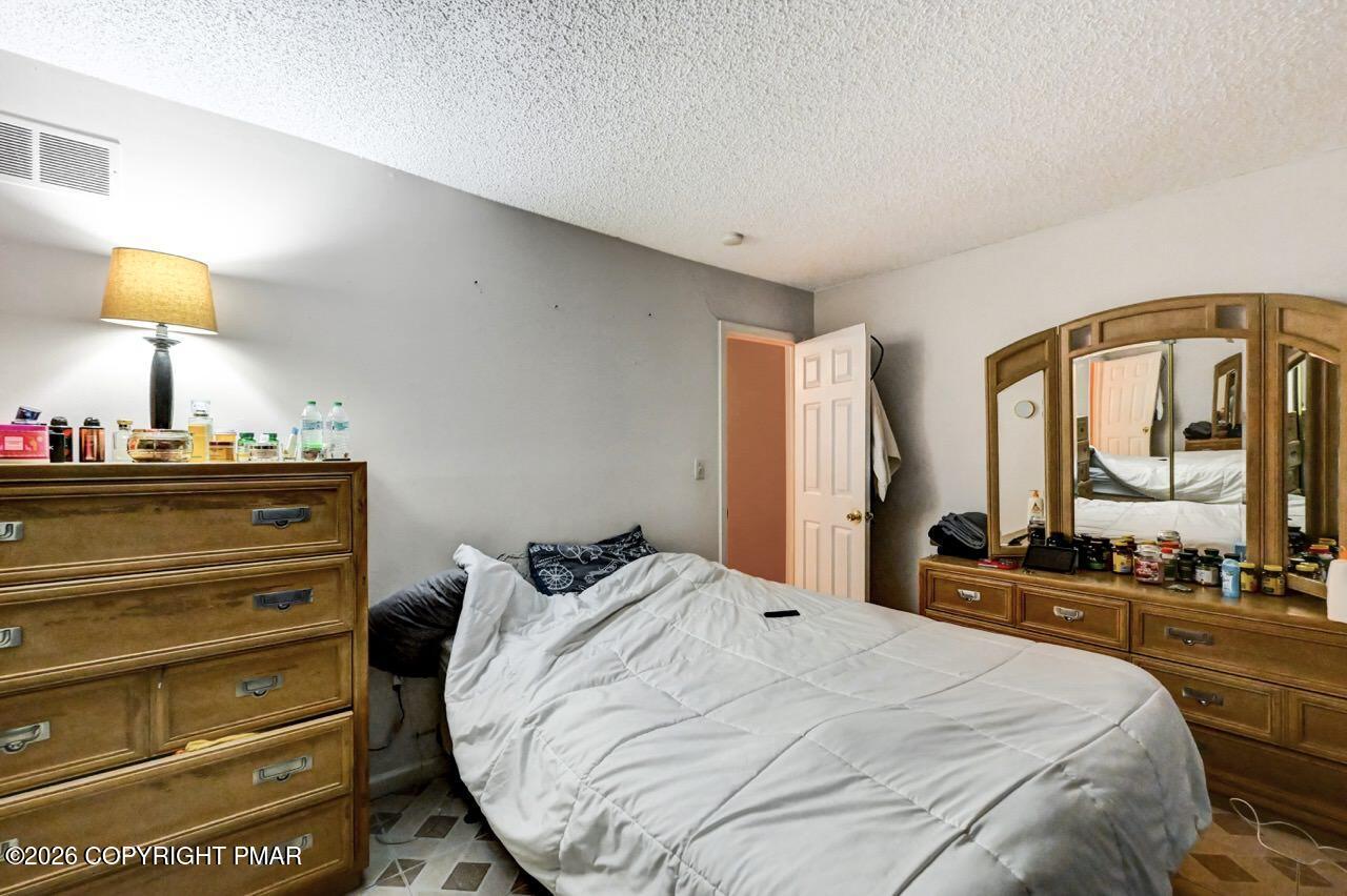 844 South Front Street Allentown, PA 18103 - Photo 31 of 45 a bedroom with a bed and a large window