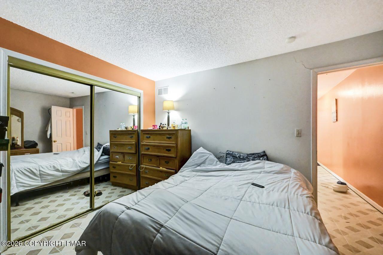 844 South Front Street Allentown, PA 18103 - Photo 32 of 45 a bedroom with a bed and wooden floor