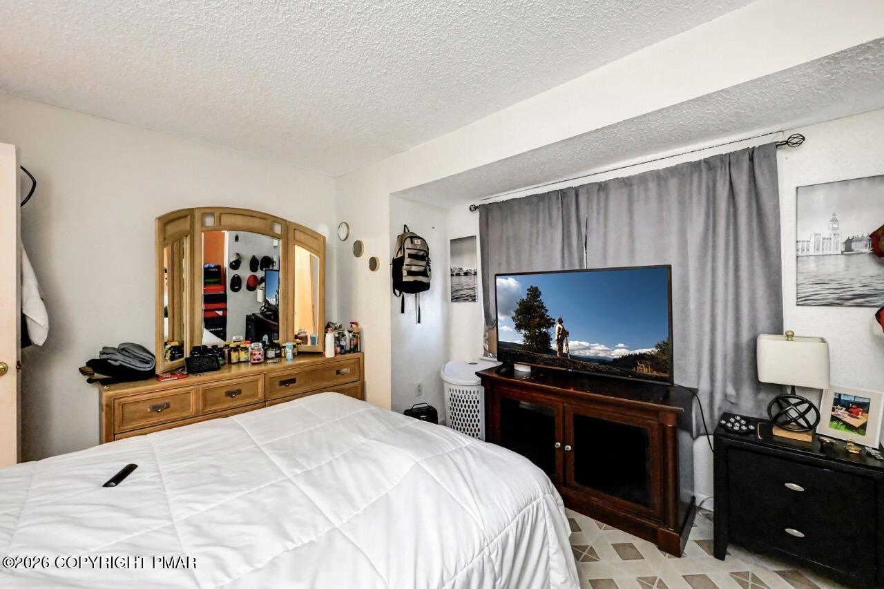 844 South Front Street Allentown, PA 18103 - Photo 33 of 45 a bedroom with a bed and a flat screen tv