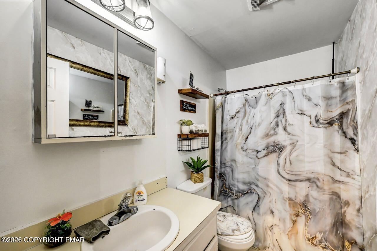 844 South Front Street Allentown, PA 18103 - Photo 36 of 45 a bathroom with a sink and a mirror