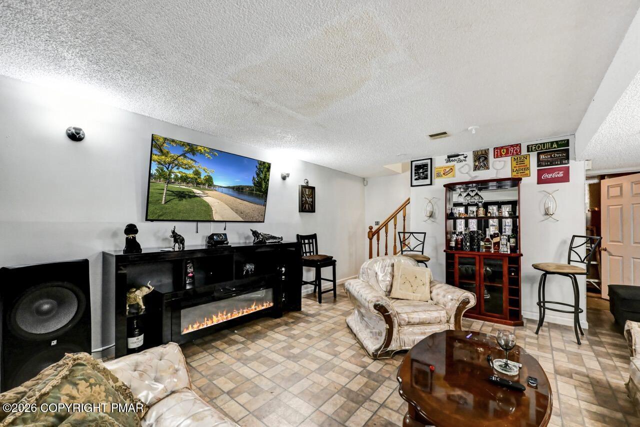 844 South Front Street Allentown, PA 18103 - Photo 7 of 45 a living room with furniture and a flat screen tv