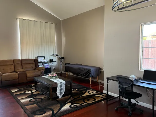 a work room with furniture and a window