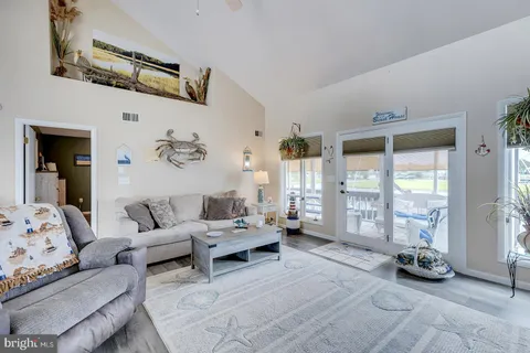 a view of living room with furniture and a fireplace