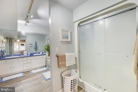a bathroom with a sink a vanity and a mirror