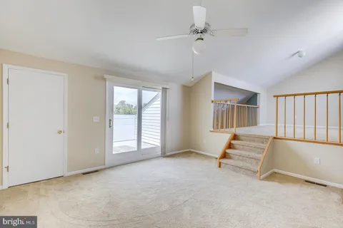 a view of a house with potted plants