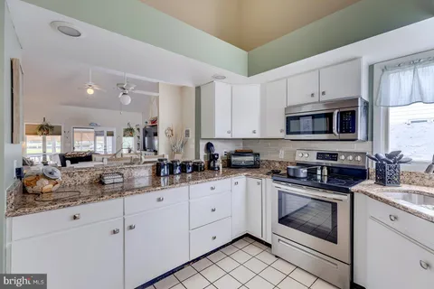 a bedroom with a bed and a television