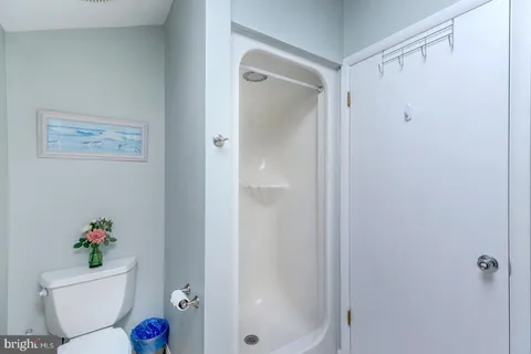a dining room with furniture window and wooden floor