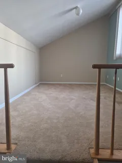 a view of a deck with two chairs and a table