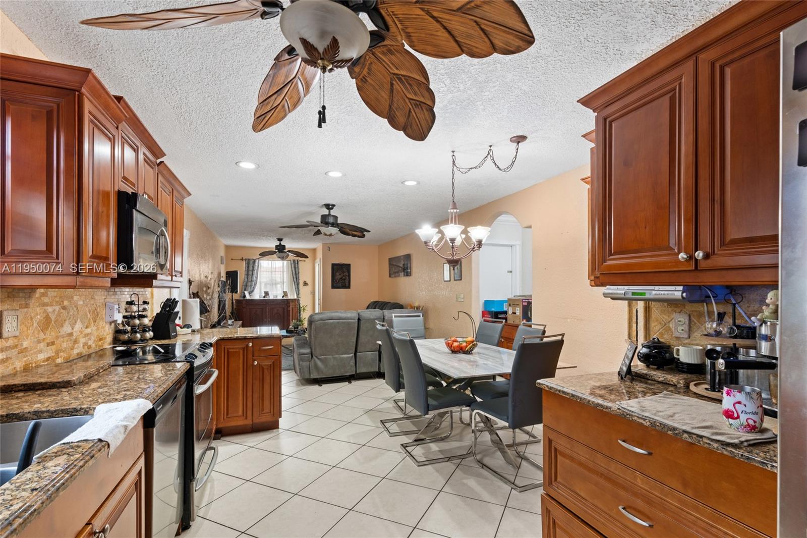 5951 Southwest 4th Street Miami, FL 33144 - Photo 13 of 23 a kitchen with granite countertop lots of counter top space