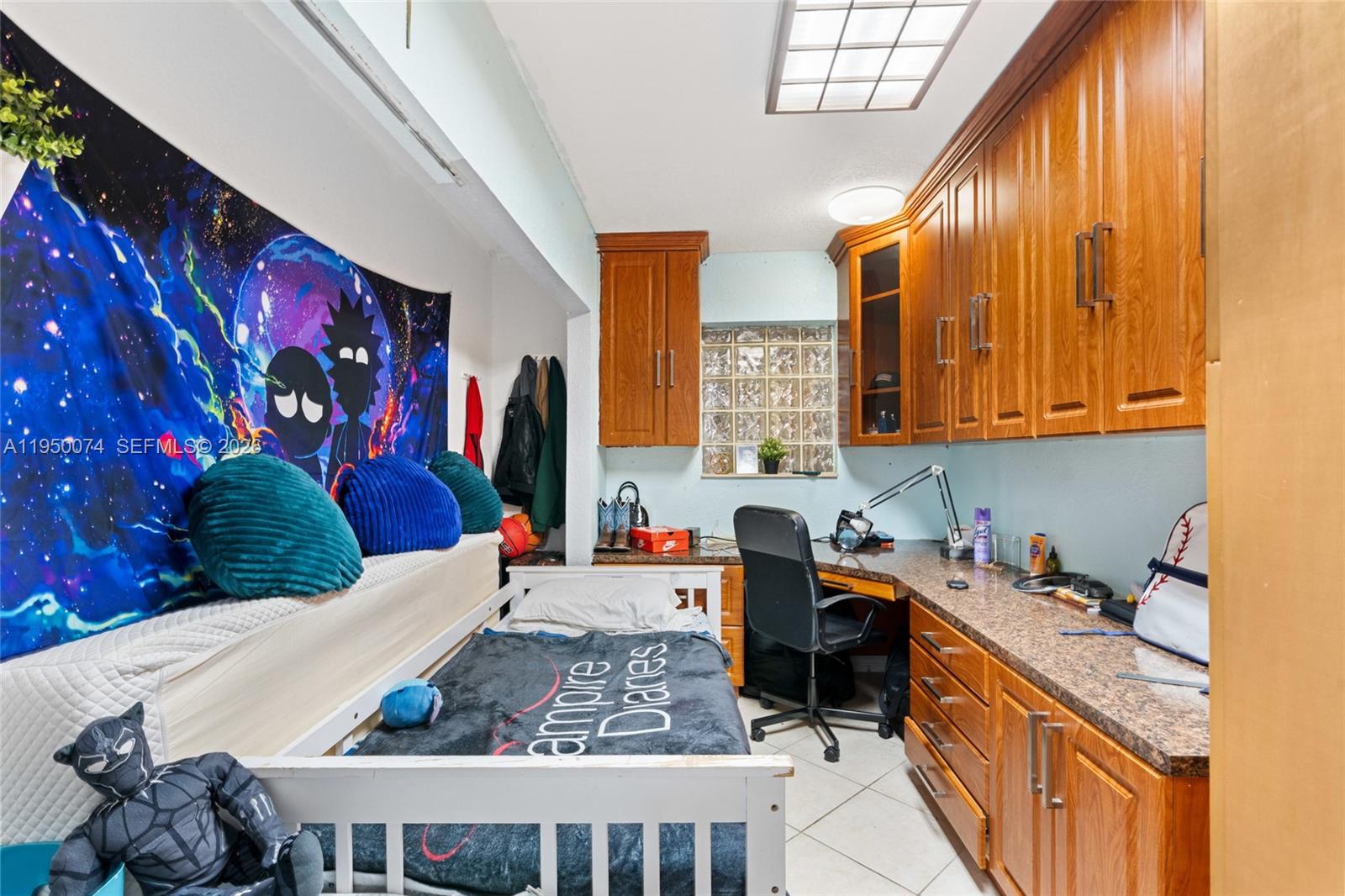 5951 Southwest 4th Street Miami, FL 33144 - Photo 15 of 23 a kitchen with stainless steel appliances granite countertop a sink dishwasher stove top oven and cabinets