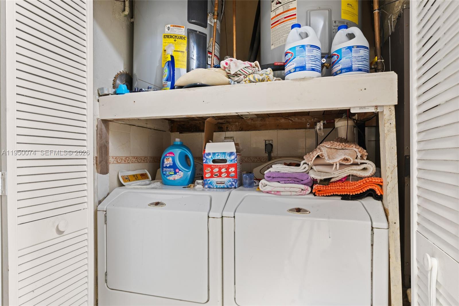 5951 Southwest 4th Street Miami, FL 33144 - Photo 18 of 23 a utility room with dryer and washer
