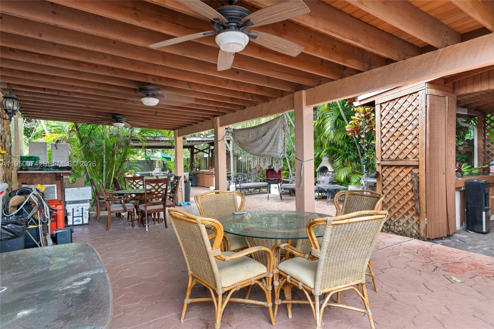 5951 Southwest 4th Street Miami, FL 33144 - Photo 19 of 23 a dining room with furniture and outdoor space