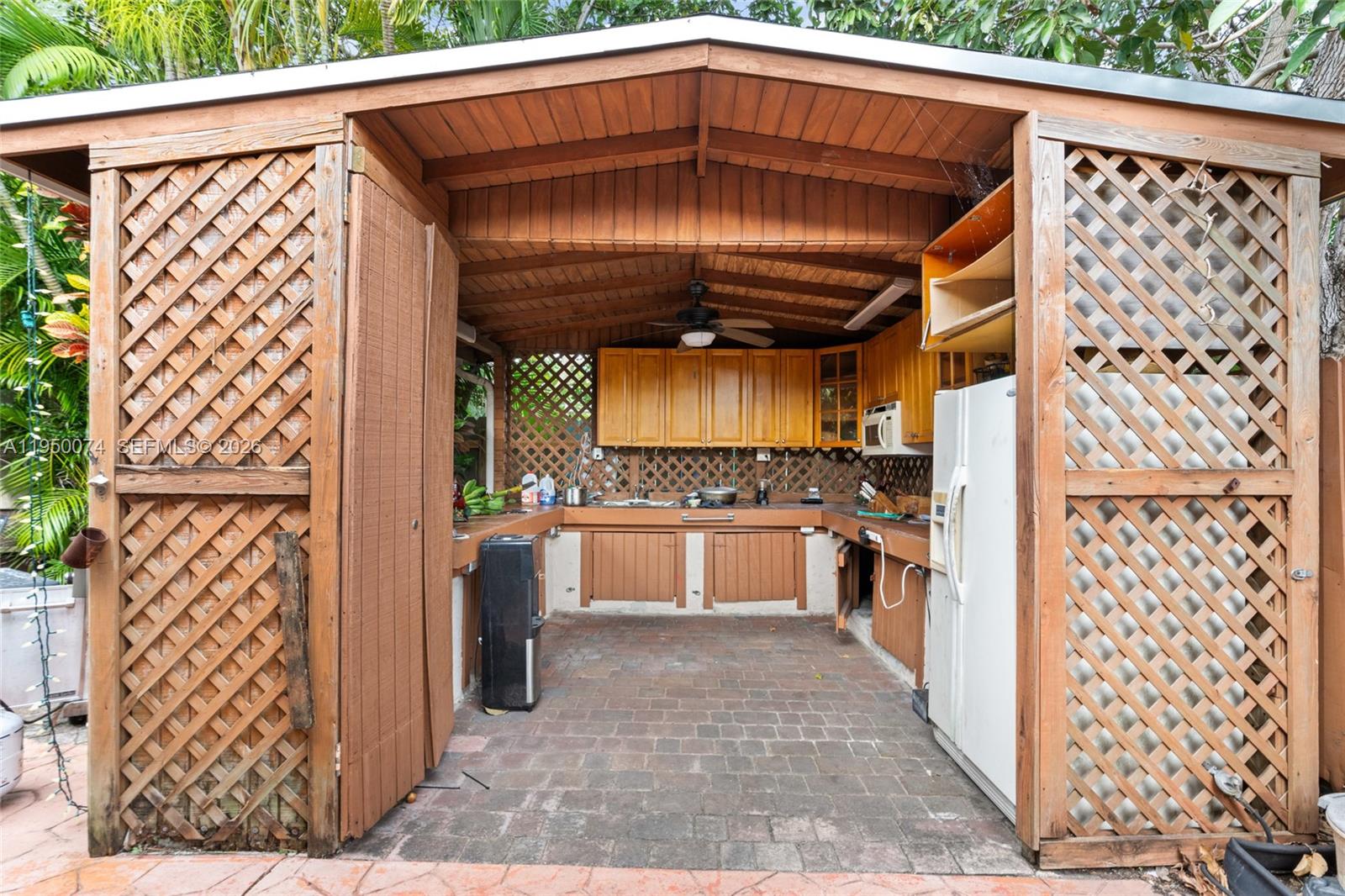 5951 Southwest 4th Street Miami, FL 33144 - Photo 22 of 23 a view of a refrigerator and car parked