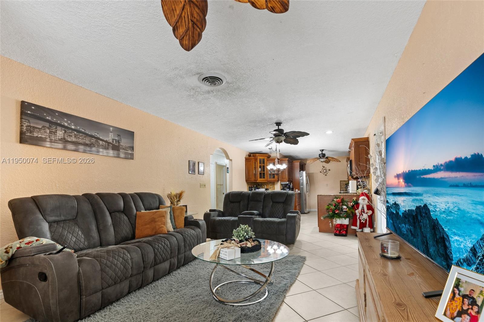 5951 Southwest 4th Street Miami, FL 33144 - Photo 10 of 23 a living room with furniture and a chandelier