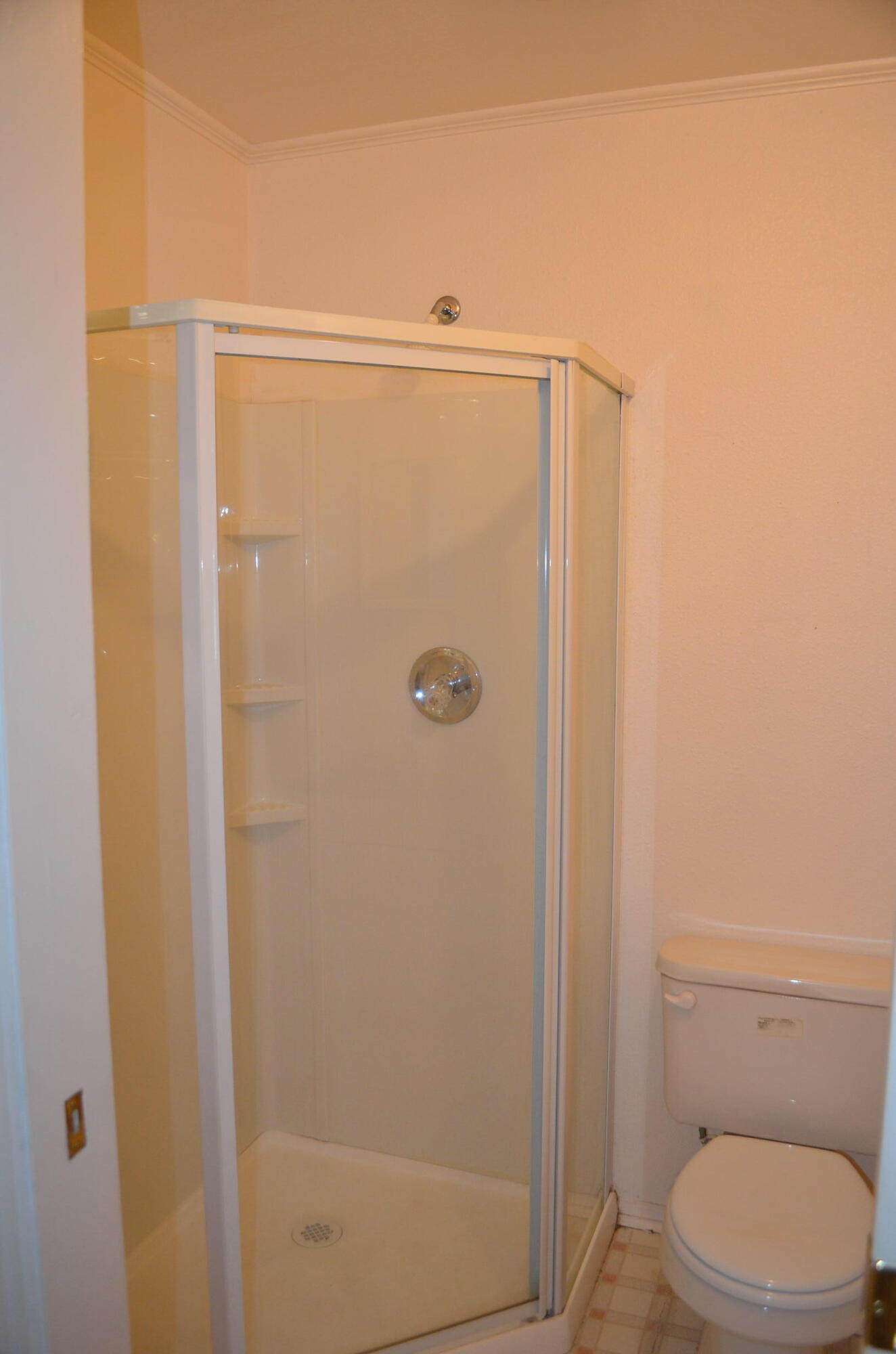 137008 Main Street Crescent, OR 97733 - Photo 17 of 50 a bathroom with a shower a toilet and sink