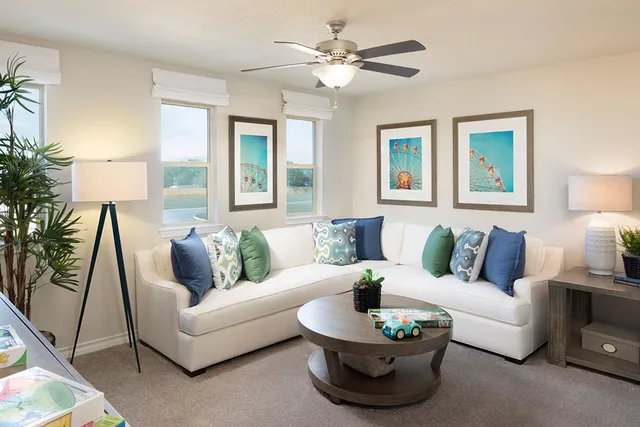 a bedroom with furniture and a large window