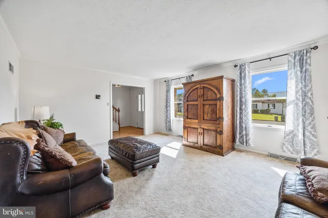 a kitchen with stainless steel appliances granite countertop a refrigerator sink and stove