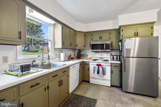a dining room with a table and chairs