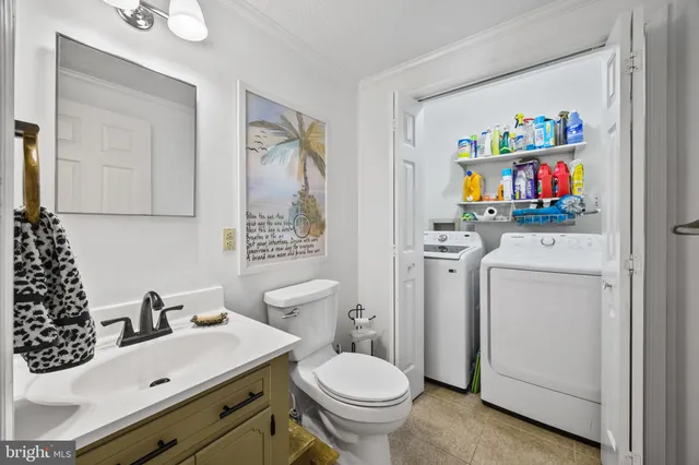 a view of a workspace with furniture and a ceiling fan
