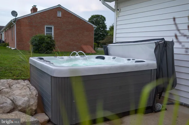 a view of a big yard with an ocean view