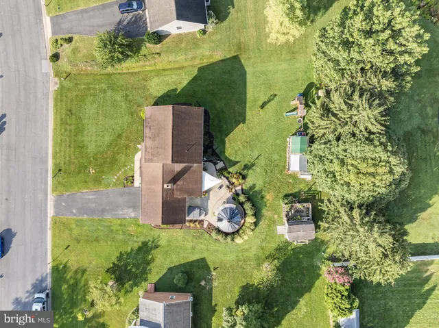 an aerial view of residential houses with outdoor space