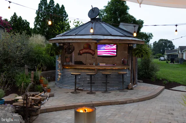a view of a chairs and table in the patio
