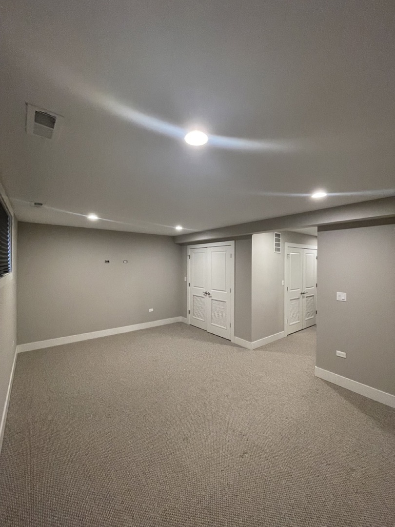 215 South Hamilton Avenue, Unit 1N Chicago, IL 60612 - Photo 23 of 23 an empty room with a empty space and windows