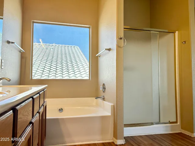 a bathroom with a bathtub and a shower