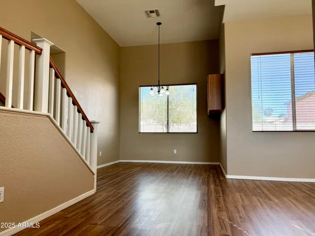 a view of room with window and hardwood floor