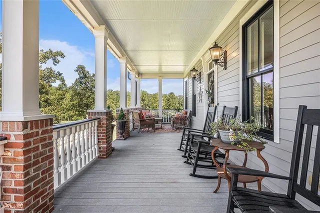 a kitchen with stainless steel appliances kitchen island granite countertop a stove and a sink