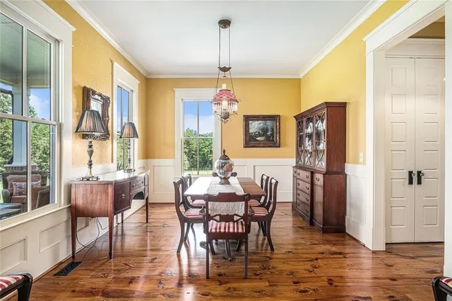 a view of a dining room with furniture and chandelier