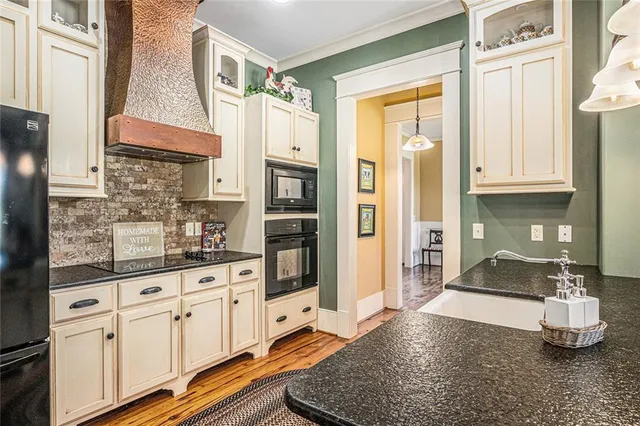 a living room with fireplace furniture and a flat screen tv