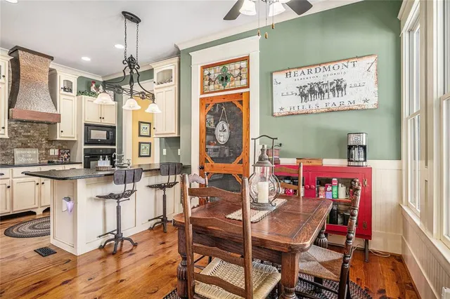 a bathroom with a granite countertop sink a mirror and a shower