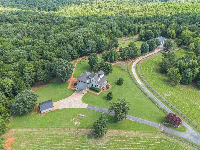 a view of a swimming pool with a yard