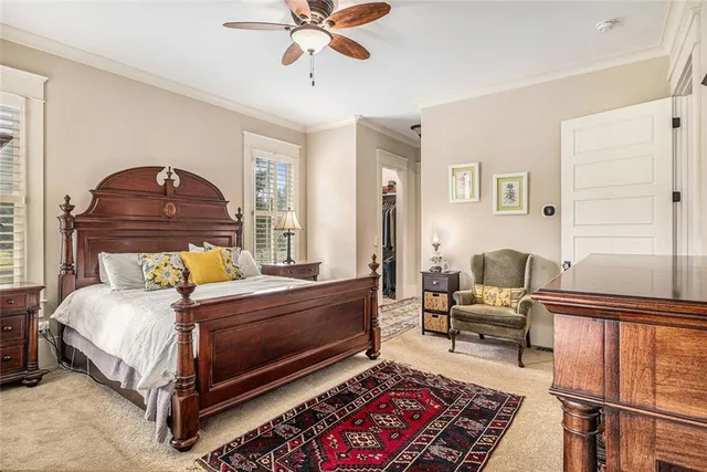 a bed room with couch and a window