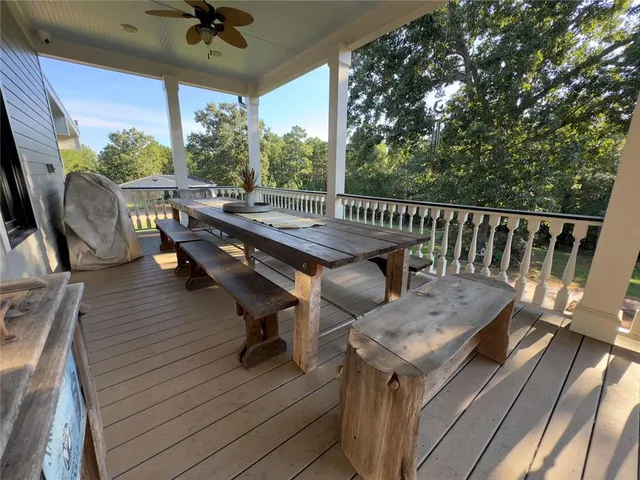a living room with furniture a window and chair