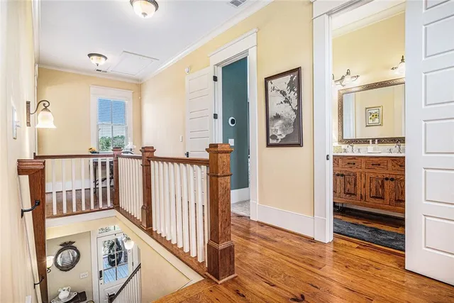 a bathroom with a granite countertop toilet sink and mirror